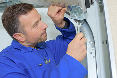 Garage door opener repair being done